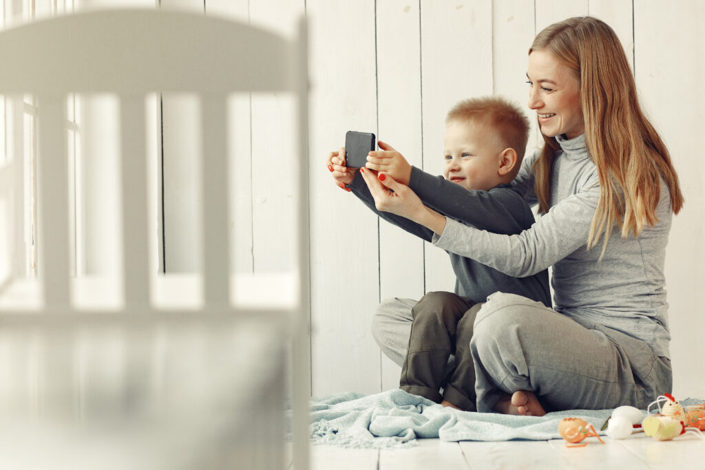 Mother and little son playing at home